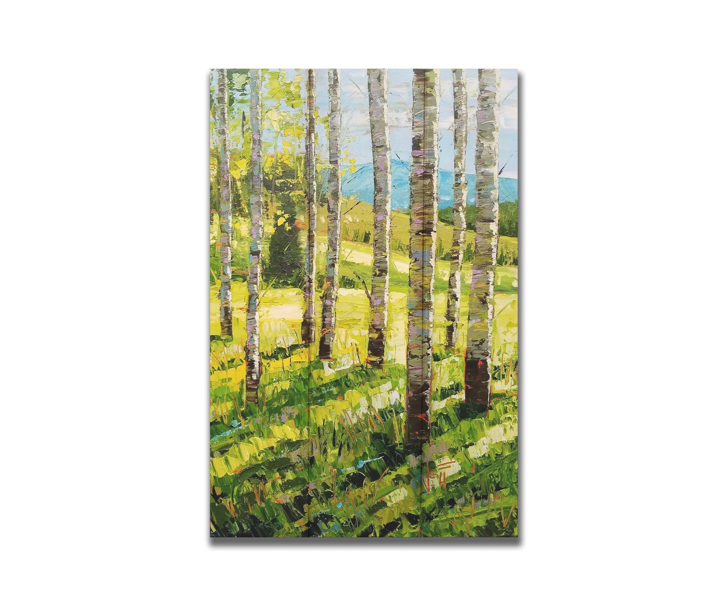 A painting of a group of birch tree trunks before a bright green grassy hill. Printed on a box board.