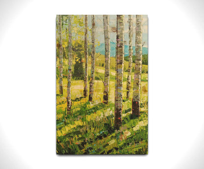 A painting of a group of birch tree trunks before a bright green grassy hill. Printed on a wood pallet.