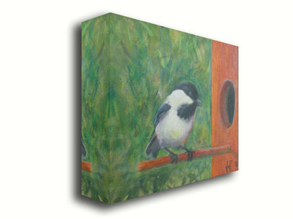 A painting of a black and white chickadee perched on an orange birdhouse, about to enter. The visible brushstrokes of the green background give the impression of foliage. Printed on canvas.