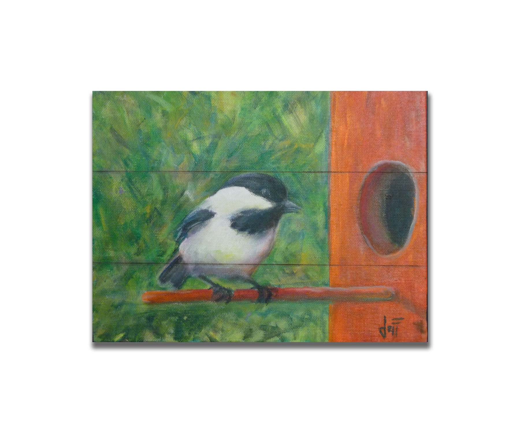 A painting of a black and white chickadee perched on an orange birdhouse, about to enter. The visible brushstrokes of the green background give the impression of foliage. Printed on a box board.