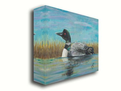 A painting of a loon swimming on the water, reflected on the surface. Printed on canvas.