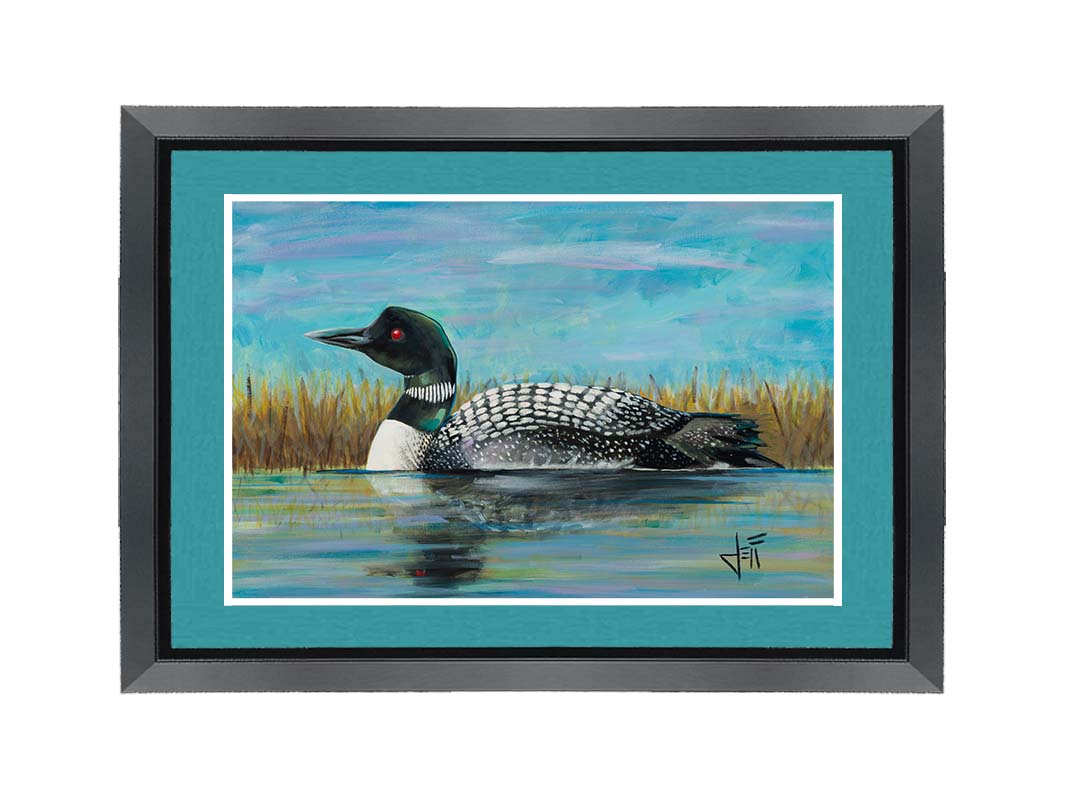 A painting of a loon swimming on the water, reflected on the surface. Printed on paper, matted, and framed.