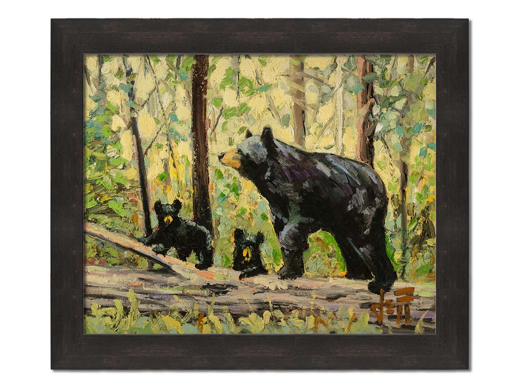 A painting of a family of three bears, walking through the forest over a log. Printed on canvas and framed.