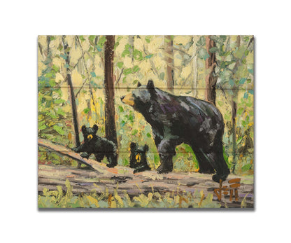 A painting of a family of three bears, walking through the forest over a log. Printed on a box board.