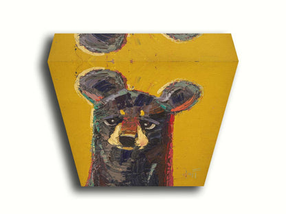 A portrait painting of a brown bear, accented with green and red, against a bright yellow background. Printed on canvas.