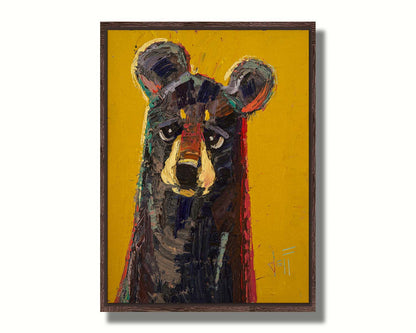 A portrait painting of a brown bear, accented with green and red, against a bright yellow background. Printed on canvas in a float frame.