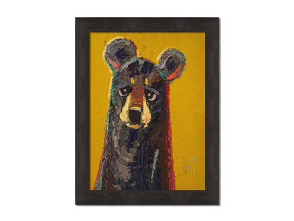 A portrait painting of a brown bear, accented with green and red, against a bright yellow background. Printed on canvas and framed.