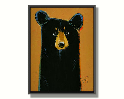 A painting of a black bear set against a yellow-orange background. It is simplified in a contemporary style that emphasizes the shape of the bear. Printed on canvas in a float frame.