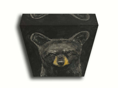 A portrait painting of a black bear against a black background. Printed on canvas.