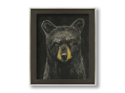 A portrait painting of a black bear against a black background. Printed on canvas and framed.