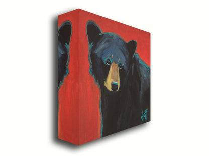 A painting of a black bear against a red background. Printed on canvas.