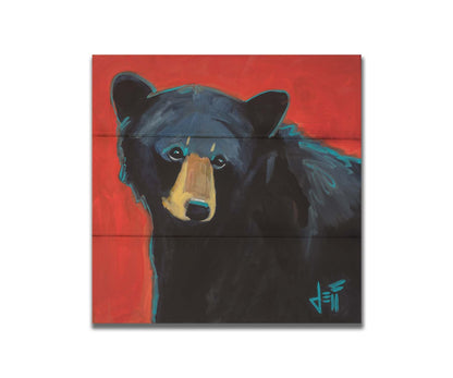 A painting of a black bear against a red background. Printed on box board.