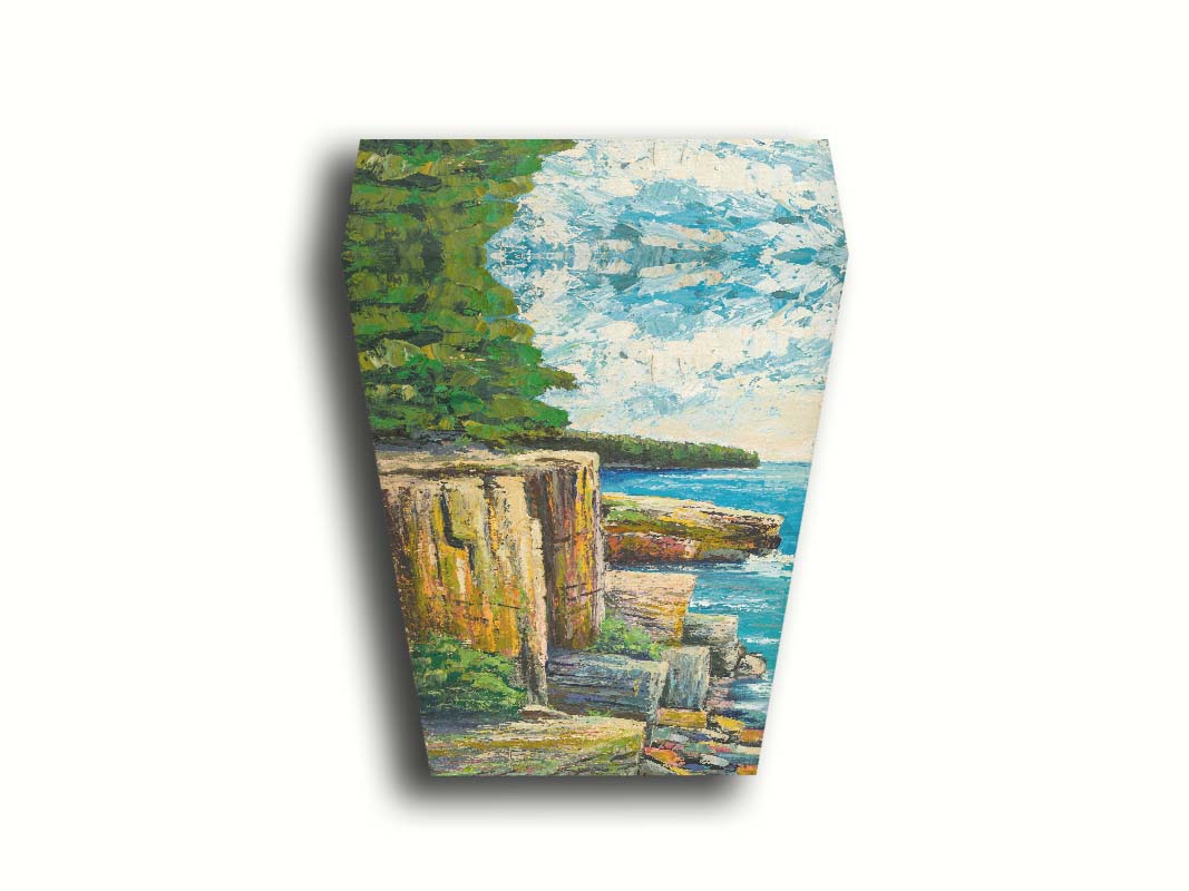 A painting overlooking a waterside clifface. Green forests grow across the tops of the cliffs, and the bright blue waters below splash against a colorful collection of rocks. Printed on canvas.