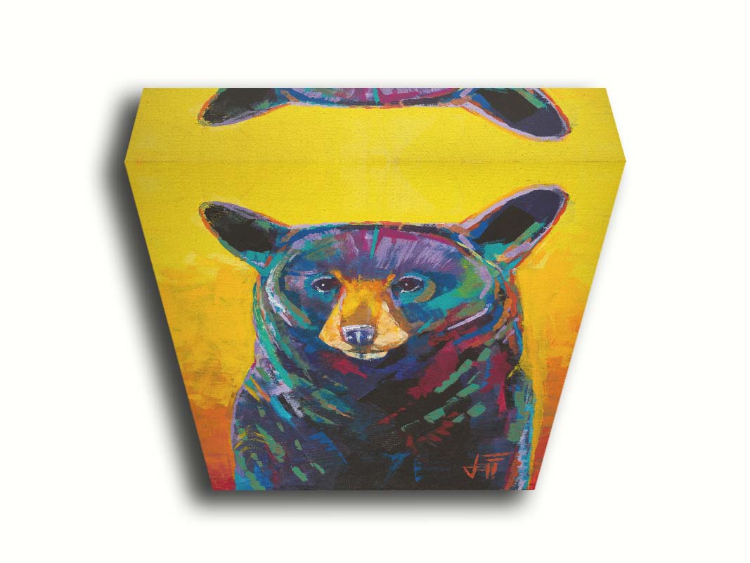 A portrait painting of a black bear, represented in colorful accents of reds, blues, greens, and purples against an orange and yellow background. Printed on canvas.