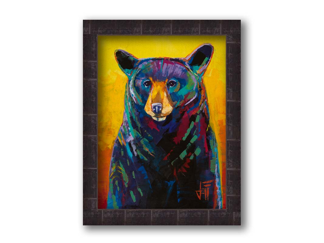 A portrait painting of a black bear, represented in colorful accents of reds, blues, greens, and purples against an orange and yellow background. Printed on canvas and framed.