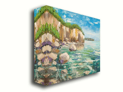 A painting of a rocky cliff overlooking clear waters on a sunny day. A vibrant green forest is growing on top of the cliffs. The teal water splashes against rocks on the shore. Printed on canvas.