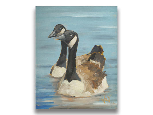 A painting of two Canadian geese swimming across smooth blue water. Printed on canvas.