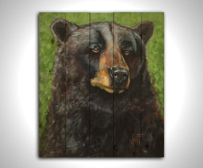 A portrait painting of a black bear against a green background. The texture and depth of the bear's fur is expertly depicted using variations in shade, tone, and texture. Printed on a wood pallet.