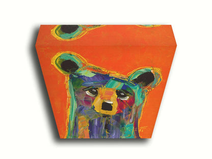 A contemporary portrait painting of a bear, in a style focusing on color and shape. Large brushstrokes of unblended blue, teal, pink, yellow, and orange create a simplified cartoonish bear. Printed on canvas.