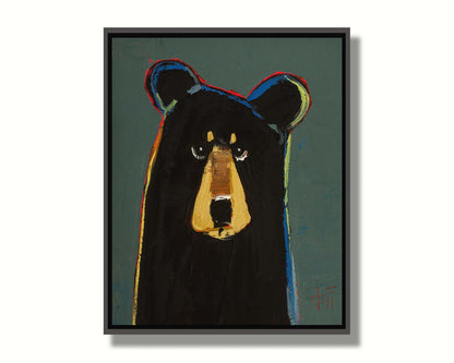 A portrait of a black bear in a simple style utilizing flat planes of color. It is outlined in red, orange, yellow, green, and blue, and set against a dusty green background. Printed on canvas in a float frame.