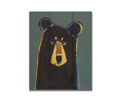 A portrait of a black bear in a simple style utilizing flat planes of color. It is outlined in red, orange, yellow, green, and blue, and set against a dusty green background. Printed on a box board.