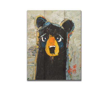 A stylized portrait painting of a black bear, set against a pale gray background. The simple shapes and flat colors are contrasted by visible palette knife and brushstrokes, which add color shift and texture. Printed on a box board.