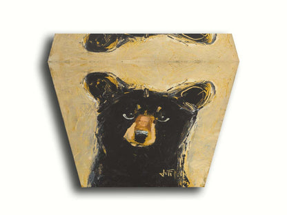 A stylized painting of a black bear against a muted yellow background. The use of flat colors emphasizes the shape of the bear, which is textured using visible brushstrokes to roughen the edges. Printed on canvas.