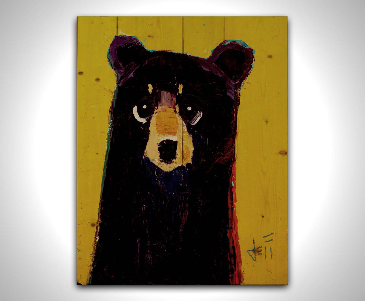 A simplified painting of a black bear against a vibrant yellow background. The bear is accented by blue, purple, and red and formed of controlled, simple shapes. Printed on a wood pallet.