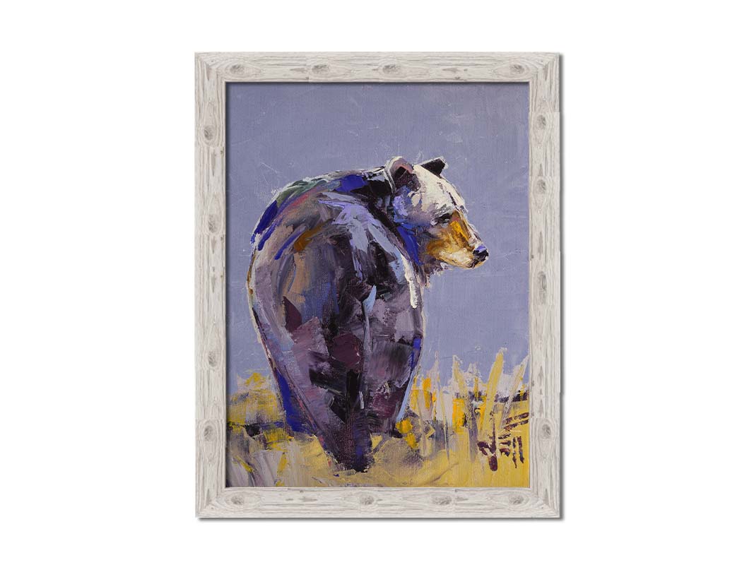 A painting of a black bear, painted in a gentle purple palette, standing in a grassy yellow field. Printed on canvas and framed.