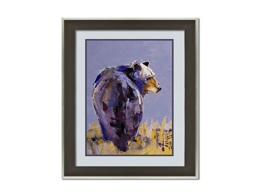 A painting of a black bear, painted in a gentle purple palette, standing in a grassy yellow field. Printed on paper, matted, and framed.