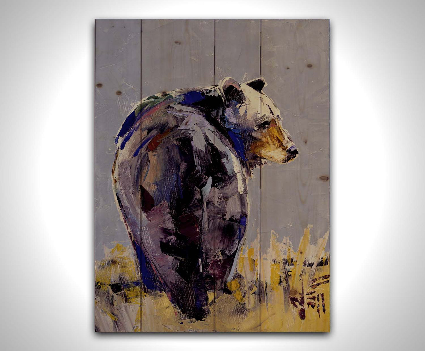 A painting of a black bear, painted in a gentle purple palette, standing in a grassy yellow field. Printed on a wood pallet.