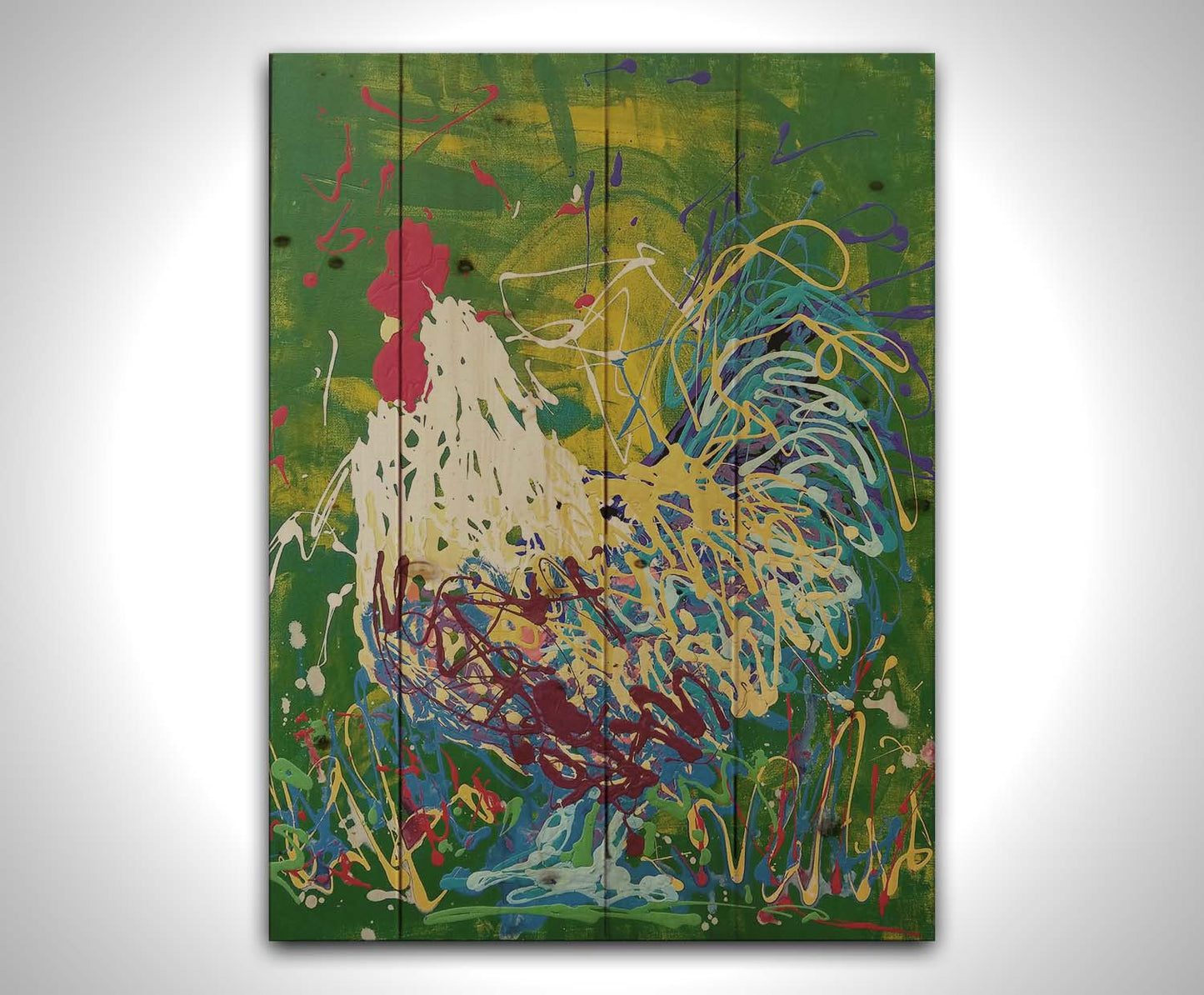 A drip painting of a white, blue, and yellow rooster against a green and yellow background. Printed on a wood pallet.