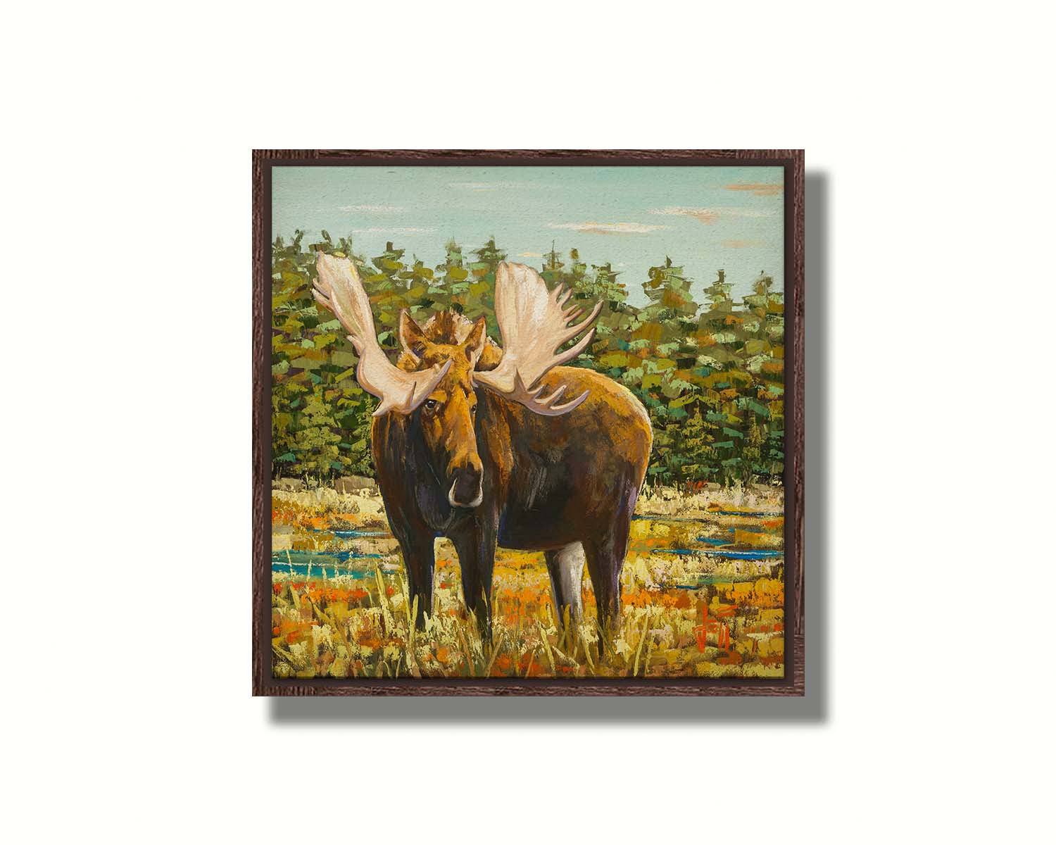 A painting of a moose standing in a bright yellow and orange field, dotted with blue puddles. An evergreen forest borders this Gunflint Trail field in Minnesota. Printed on canvas in a float frame.