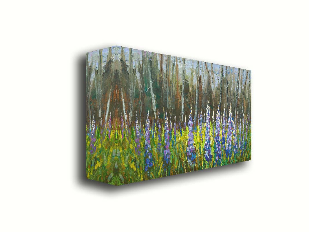 A painting of a field of blue and purple lupine flowers in a green field, backed by a forest. Printed on canvas.