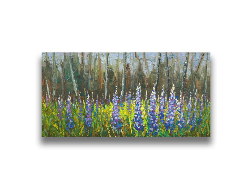 A painting of a field of blue and purple lupine flowers in a green field, backed by a forest. Printed on canvas.