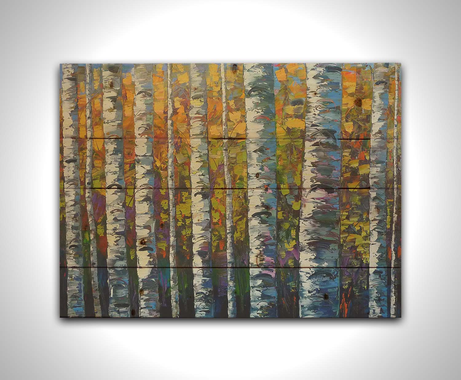 A painting of a dense forest of birch trees, close up on their parallel trunks and peeling bark. Their colorful leaves creating a stunning display of yellows, greens, blues, and purples. Printed on a wood pallet.