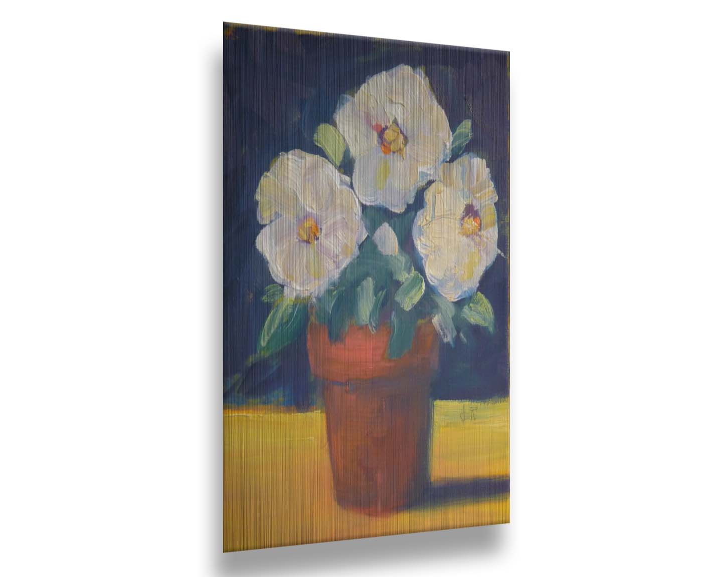 A painting of three white flowers in an orange clay pot. It is sitting on a yellow surface against a dark blue bathroom. Printed on metal.