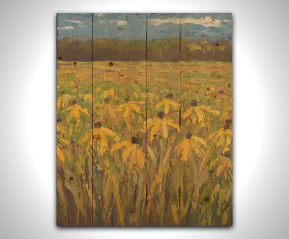 A painting of an expansive field of yellow coneflowers, bordered by woods on the horizon. Printed on a wood pallet.