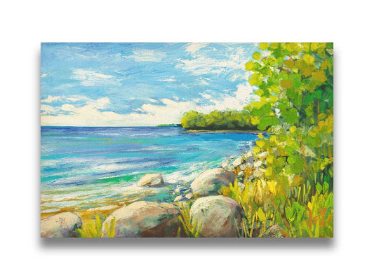 A painting of a calm bayside view. Bright green trees and foliage line the shore alongside smooth gray stones, and a blue sky with fluffy clouds reflects off smooth waters. Printed on canvas.