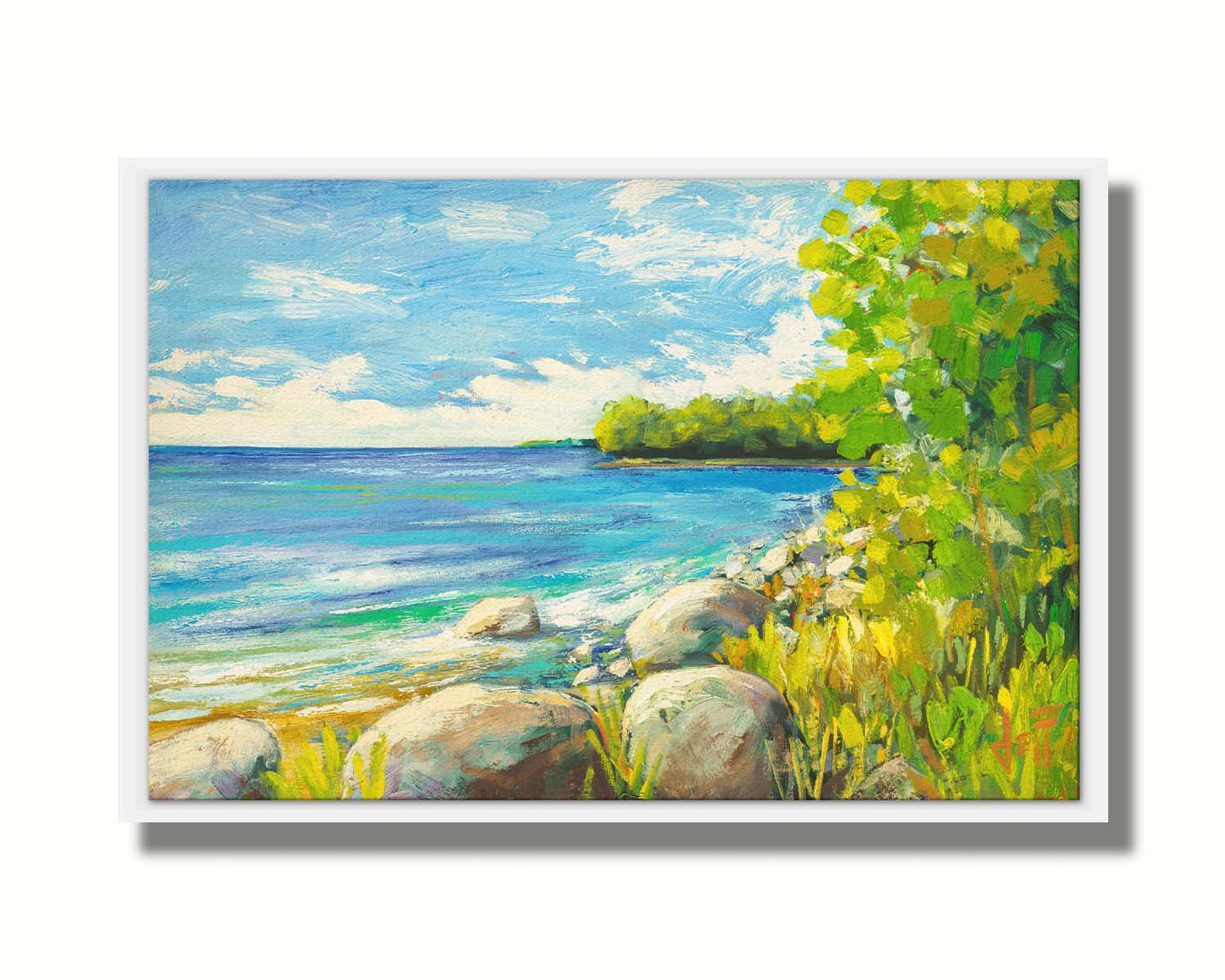 A painting of a calm bayside view. Bright green trees and foliage line the shore alongside smooth gray stones, and a blue sky with fluffy clouds reflects off smooth waters. Printed on canvas in a float frame.