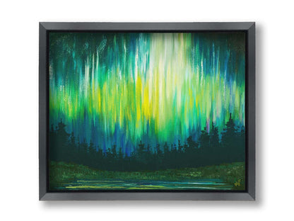 A painting of a colorful aurora in yellow, green, and blue in the sky above an evergreen forest, which surrounds a body of water reflecting the aurora. Printed on canvas and framed.