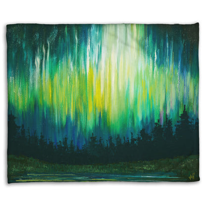 A coral fleece blanket printed with a painting of a colorful aurora in yellow, green, and blue above an evergreen forest.