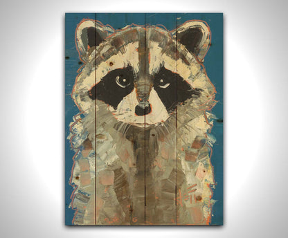 A portrait painting of a gray raccoon against a cobalt blue background. Rectangular, textured brushstrokes emphasize the fluffy textures of its fur. Printed on a wood pallet.