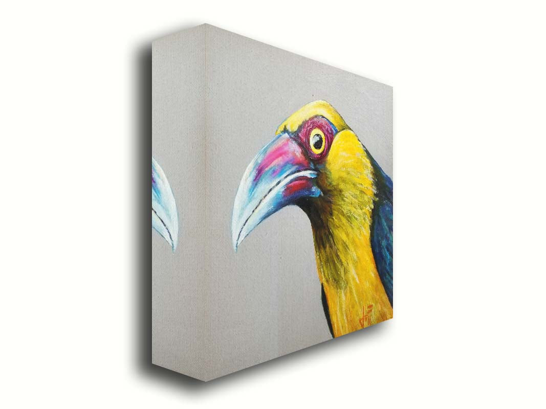 A painting of a striking saffron toucanet, whose yellow feathers pop against the neutral gray background. The light reflecting off its eye gives it an intense, intrigued, lifelike gaze. Printed on canvas.