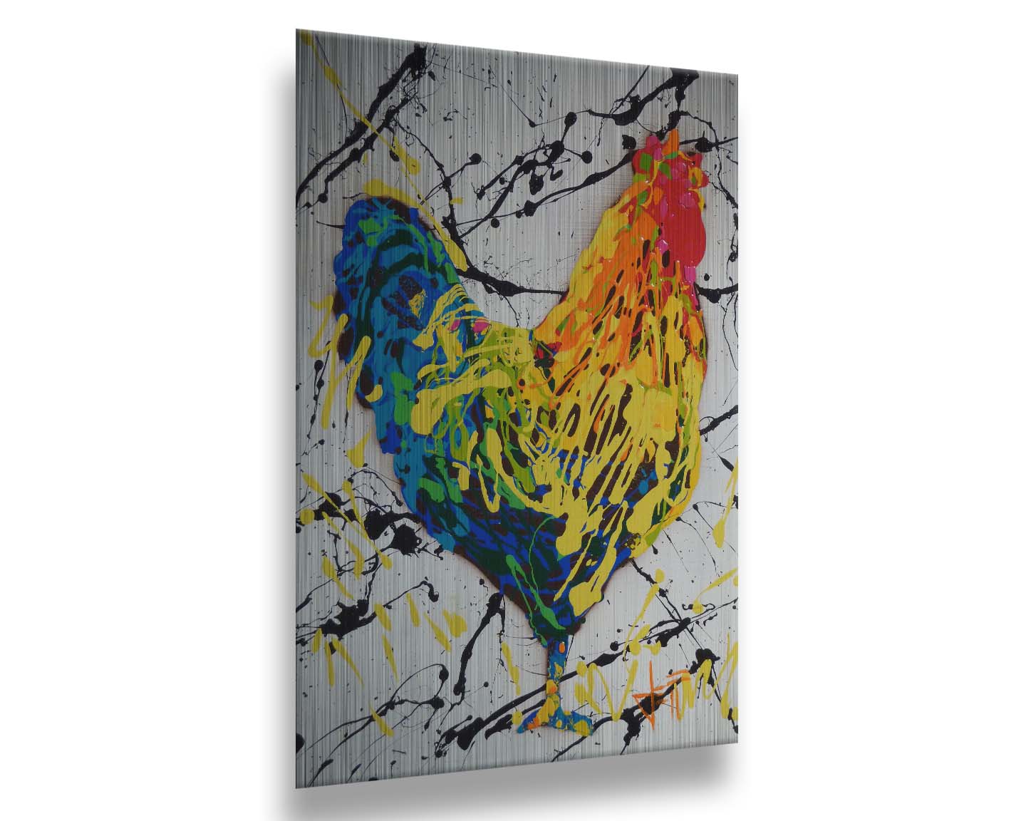 A drip painting of a rooster in red, orange, yellow, green, and blue set against a white background speckled with black and yellow. Printed on metal.