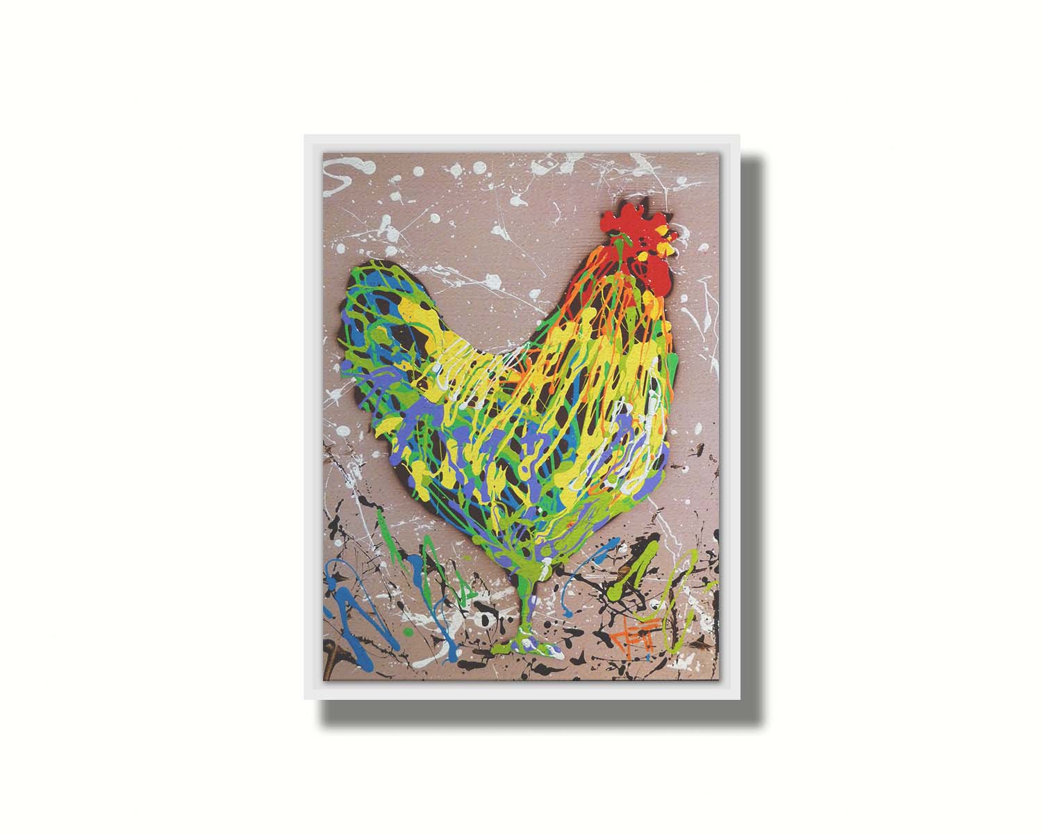 A drip painting of a rooster in yellow, green, blue, and orange set against a tan background speckled with white and black. Printed on canvas in a float frame.