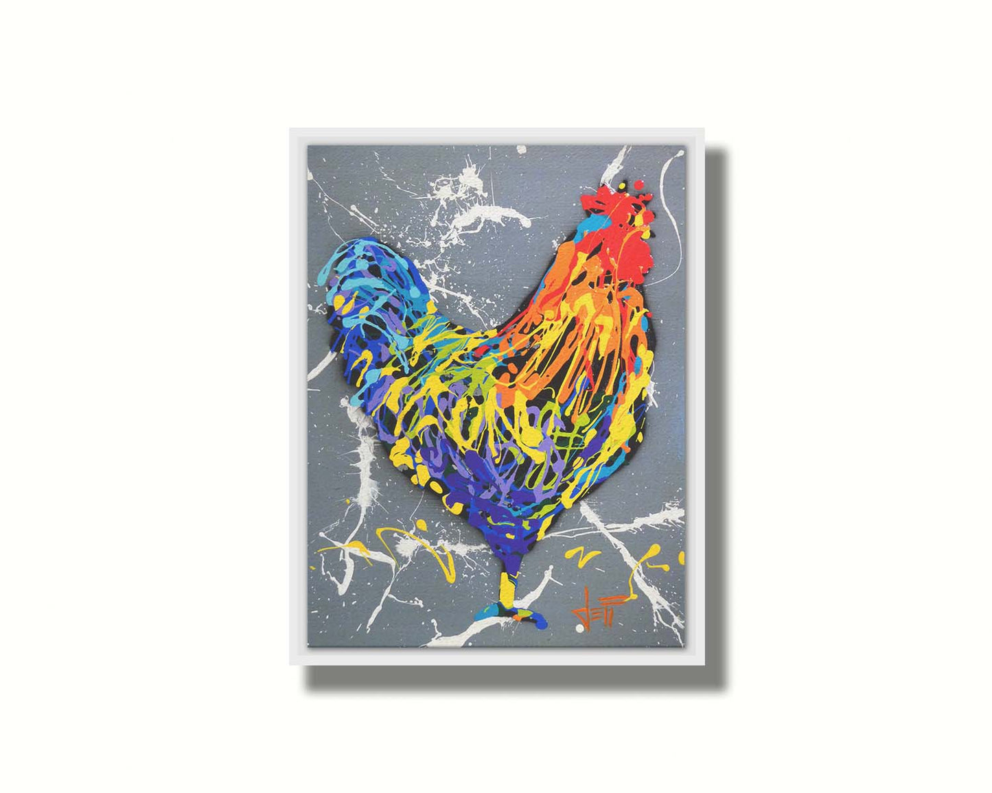 A drip painting of a rooster in a rainbow of colors, against a sleek gray backdrop, accented by white splashes. Printed on canvas in a float frame.