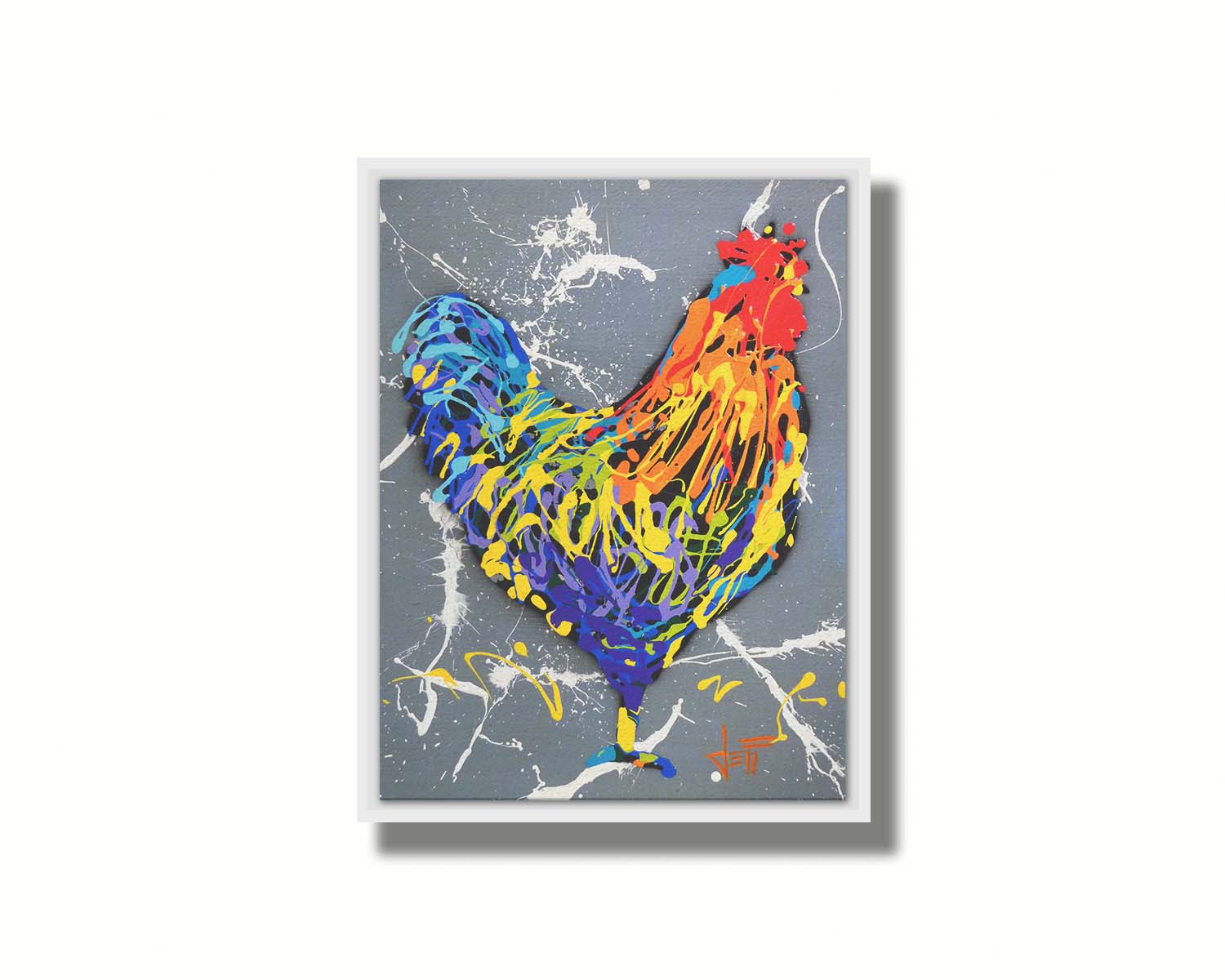 A drip painting of a rooster in a rainbow of colors, against a sleek gray backdrop, accented by white splashes. Printed on canvas in a float frame.