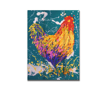 A drip painting of a rooster in vibrant shades of orange, pink, and purple against a rich teal background highlighted by white drips. Printed on a box board.