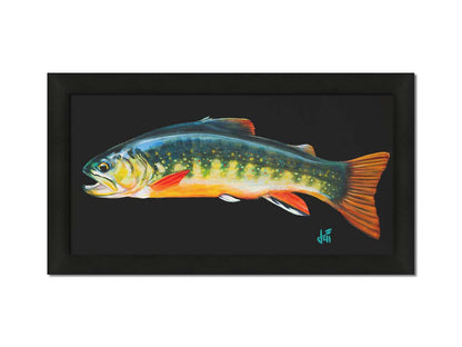 A painting of a colorful brook trout– in green, yellow, and orange– against a bold black background. Printed on canvas and framed.